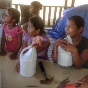 Participants in the Tippy Tap class are waiting for additional instructions on how to build their hand-washing stations 