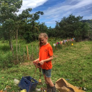 Ellie is the oldest of the three Wood children and my most favorite interpreter. Ellie is my village teammate and we travel together all the time.  In this photo, Ellie found some items in the village trash pile that could be used for up-cycling craft projects. 