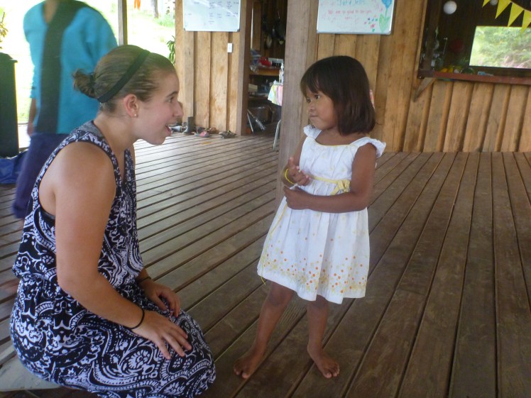 Jess has just tied a little bracelet on this cutie after her mom finished making it for her daughter
