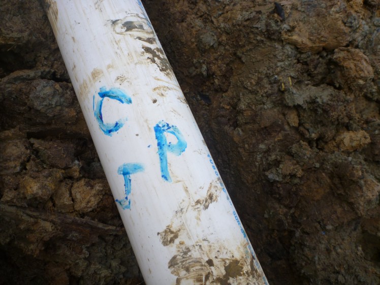 Jess added our initials to the pipe before we buried it 