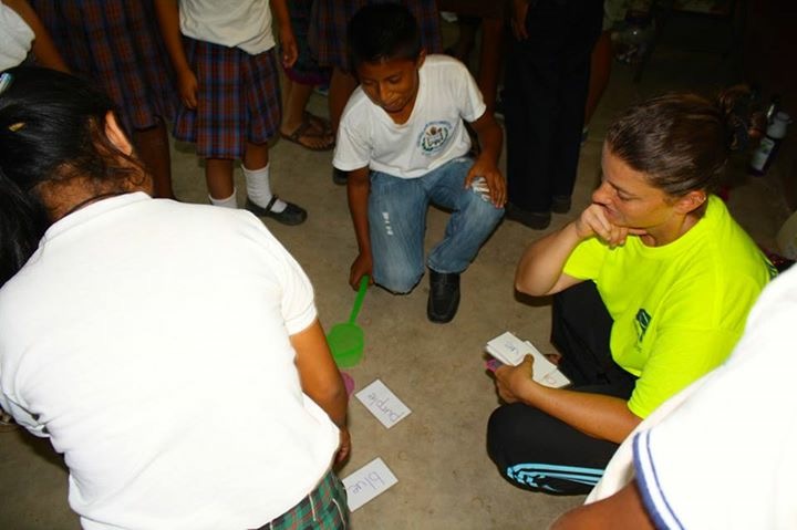 Jen playing a vocab game she developed to help the kids learn english words 